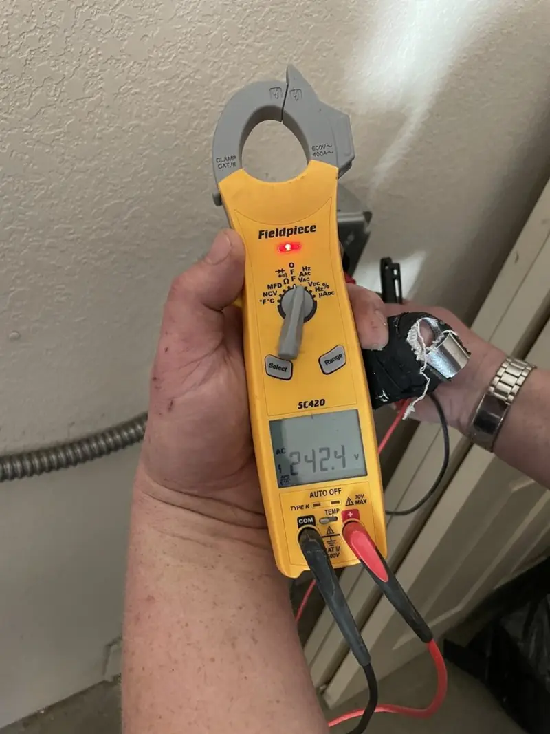 Voltage testing with clamp meter during Generator Installation in San Miguel